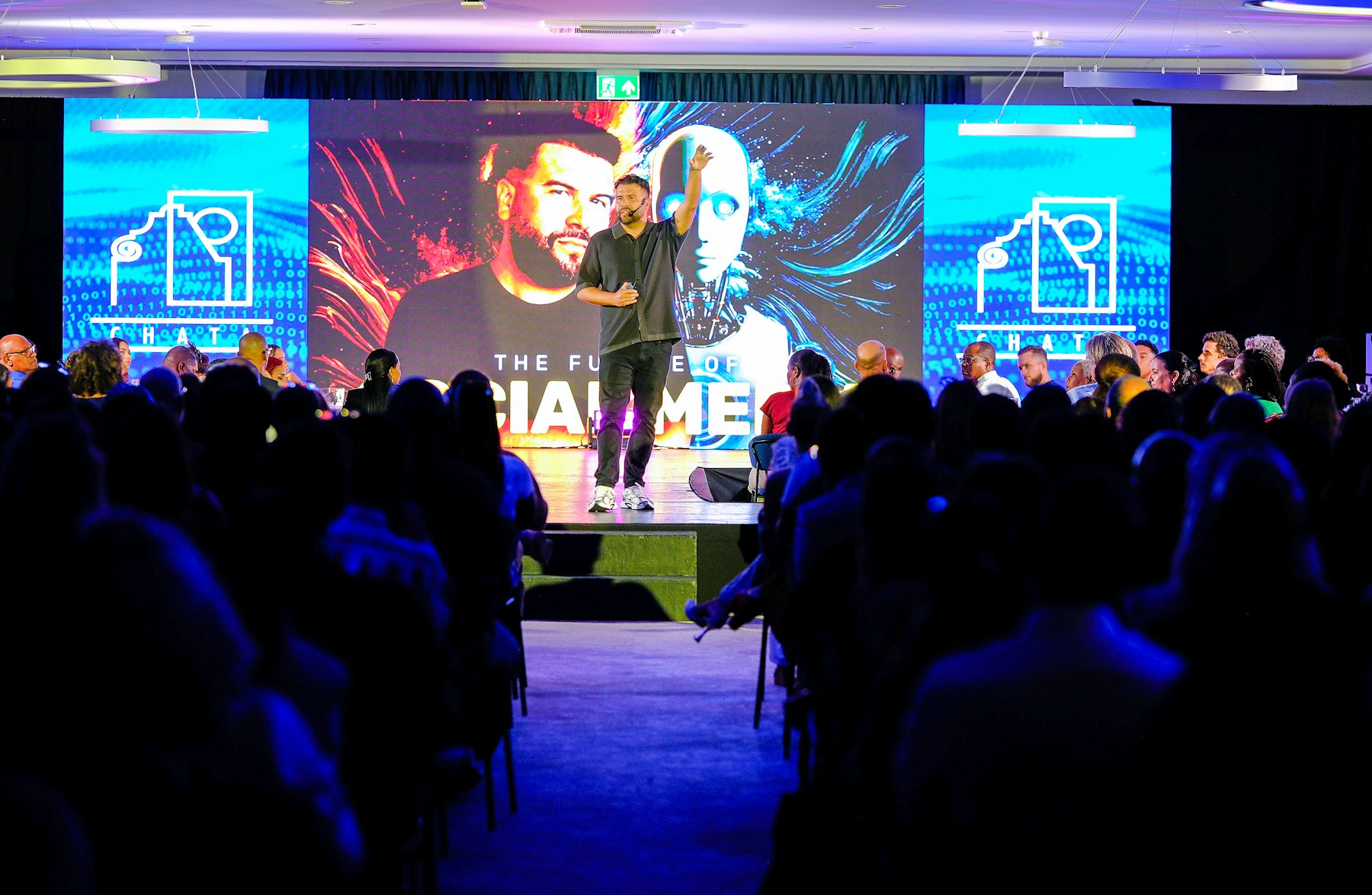 Speaker presenting to a conference audience